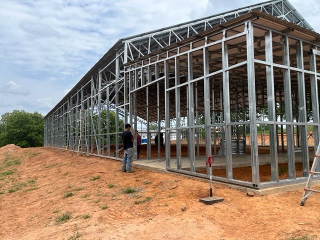 Equestrian arena steel framing and gable end during construction