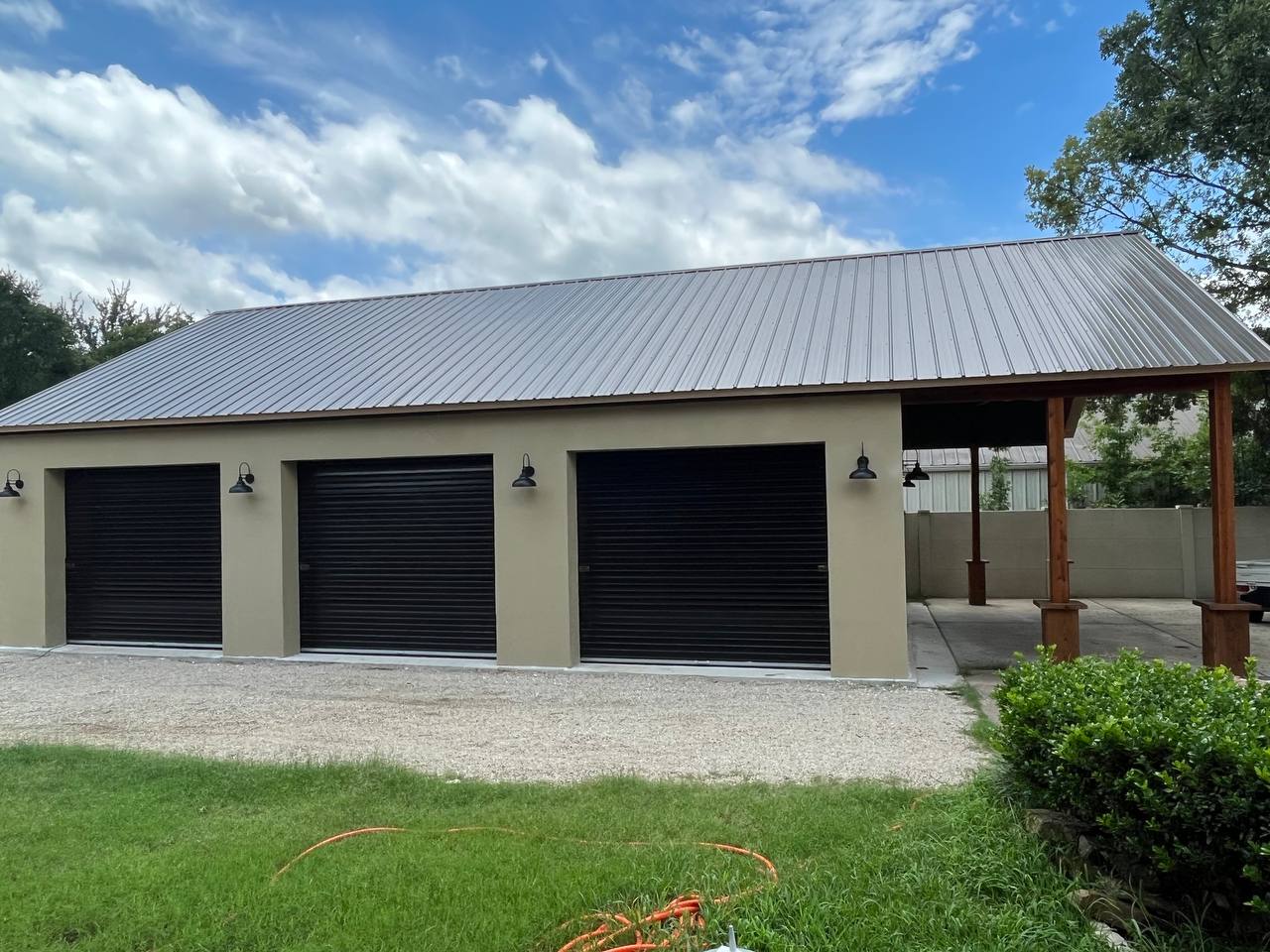 Residential garage door side with AAC cladding — DFW